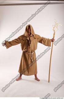 01 2019 01 JOEL ADAMSON MONK STANDING POSE WITH A…